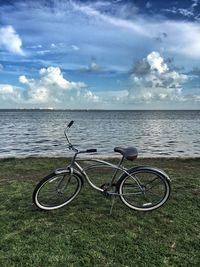 Bicycles parked by sea