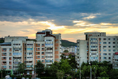 Buildings against sky during sunset