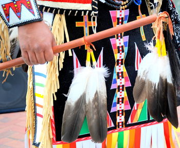 Native american indian tribal clothing displayed outdoors.