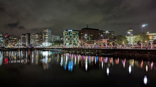 Illuminated buildings at waterfront