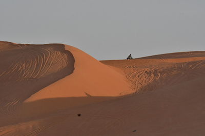 View of desert against clear sky