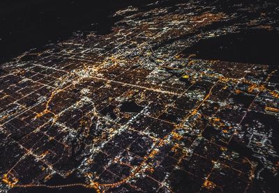 Aerial view of illuminated city at night