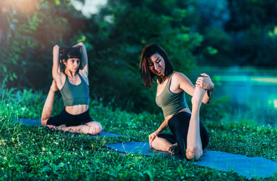 Yoga women by the water. king pigeon