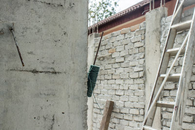 Low angle view of pipes on wall of building