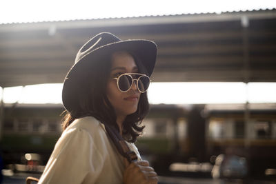 Portrait of young woman wearing sunglasses