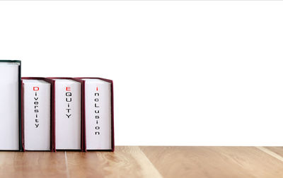 High angle view of camera on table against white background