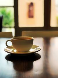 Close-up of coffee cup on table in cafe