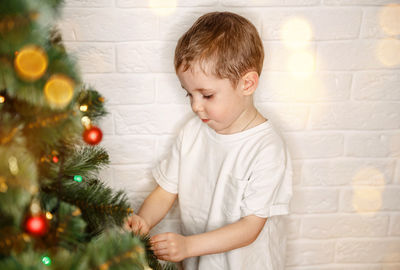 Boy on christmas tree