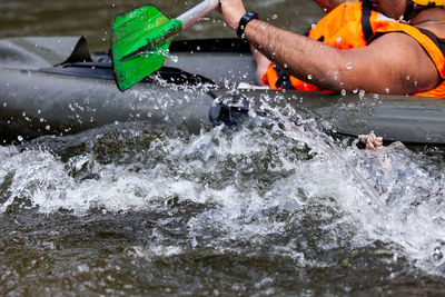 Person splashing water in sea