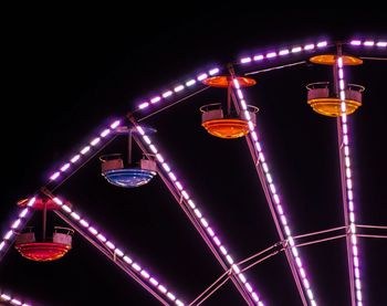 Low angle view of illuminated lights at night