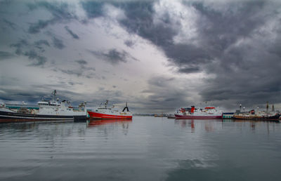 Boats moored at harbor