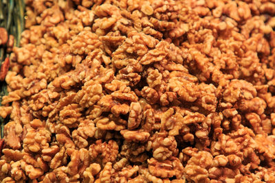 Group of peeled walnuts in a basket for sale