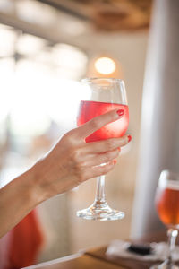 Red wine in a wine glass on table 