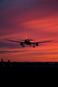 Sunset view of a plane taking off 