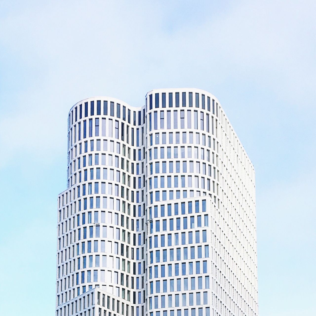 low angle view, architecture, building exterior, skyscraper, city, built structure, sky, modern, outdoors, day, tower, no people, tall, building story, office block