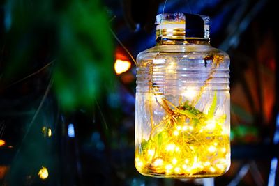 Close-up of illuminated jar at night