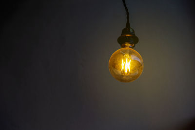 Close-up of illuminated light bulb