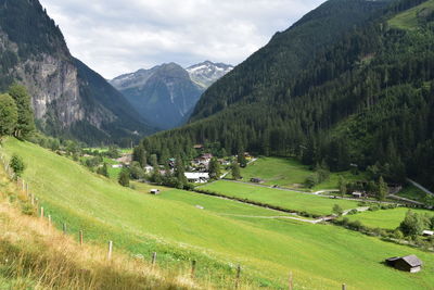 Scenic view of landscape and mountains against sky