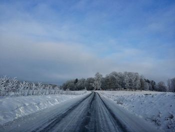 View of snow covered road in winter