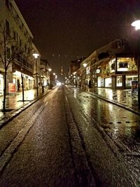 Surface level of wet street at night