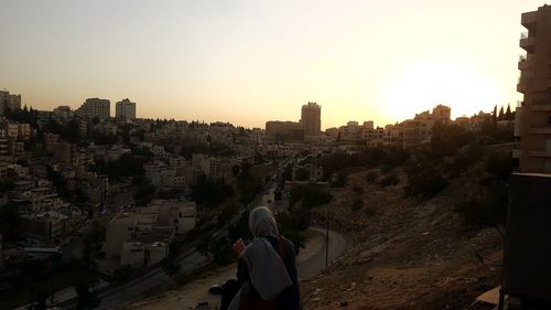 High angle view of buildings against sky during sunset