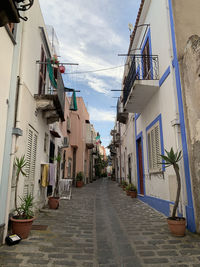 Narrow alley amidst buildings in city