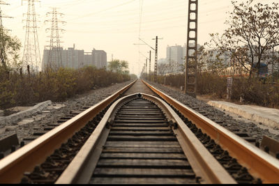 Surface level of railroad tracks against sky
