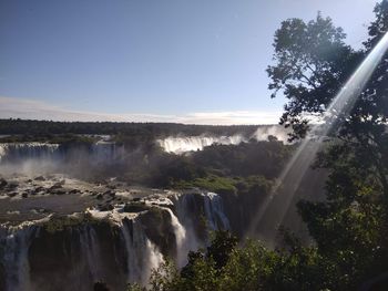 Scenic view of waterfall against clear sky