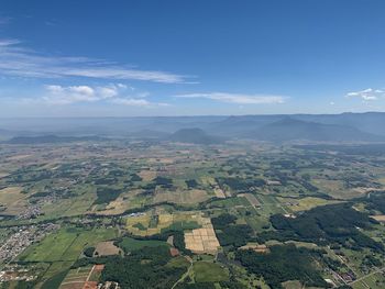 Aerial view of agricultural field against sky