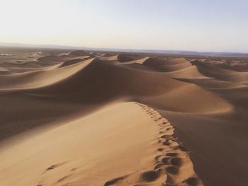 Scenic view of desert against clear sky