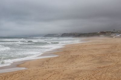 Scenic view of beach against sky