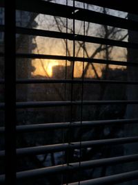 Scenic view of sunset seen through window