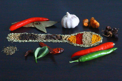 High angle view of chili peppers on table