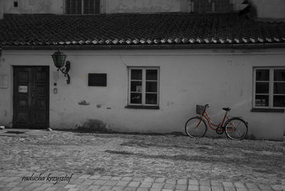 Bicycle against building in city