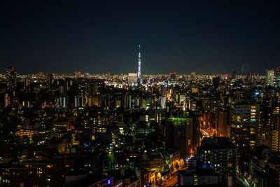 High angle view of illuminated buildings in city at night