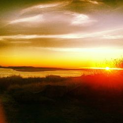 Scenic view of sunset over river