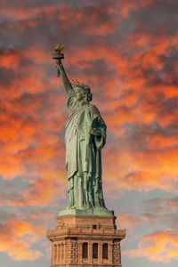 Low angle view of statue against sky during sunset