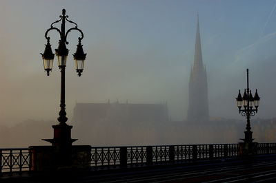 Basilica of st michael seen from pont de pierre in foggy weather