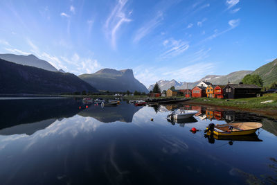 Panoramic view of lake by buildings against sky