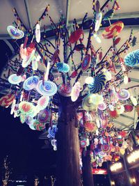 Low angle view of illuminated lanterns hanging in store