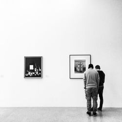 Woman standing against wall