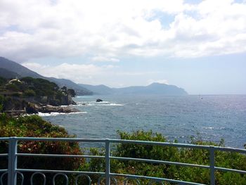 View of calm sea against cloudy sky