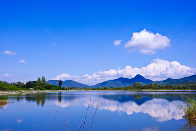 Scenic view of lake against blue sky