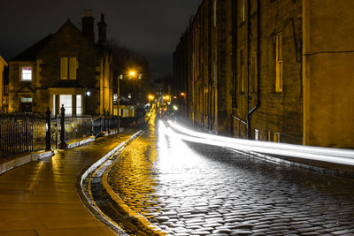 Illuminated light trails on street at night