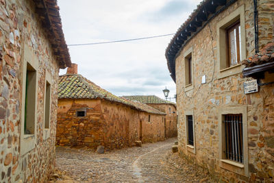 Alley amidst buildings in town