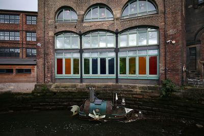 Sculpture on glass window of building