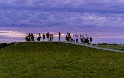 People on field against sky