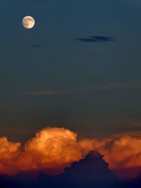 Scenic view of moon against sky at sunset