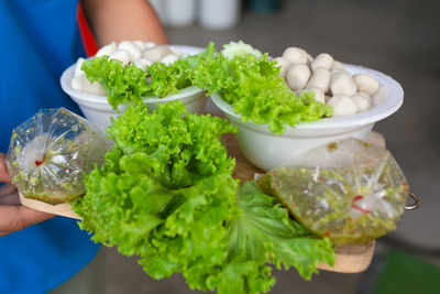 Midsection of woman holding food