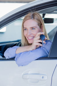 Close-up of woman sitting car